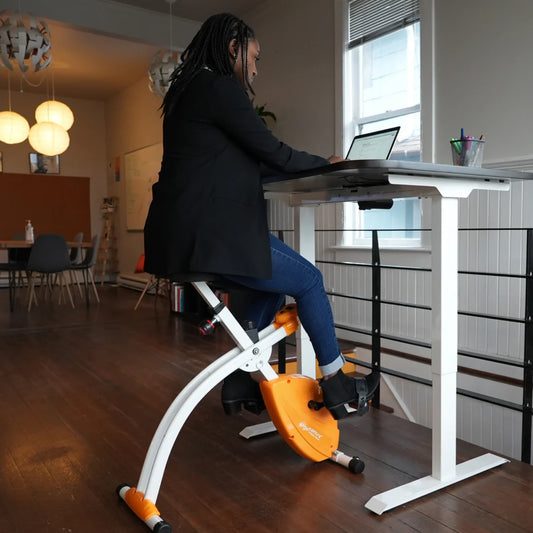 Pedal Your Way to Better Health: The Benefits of Using an Under Desk Bike in Your Daily Work Routine